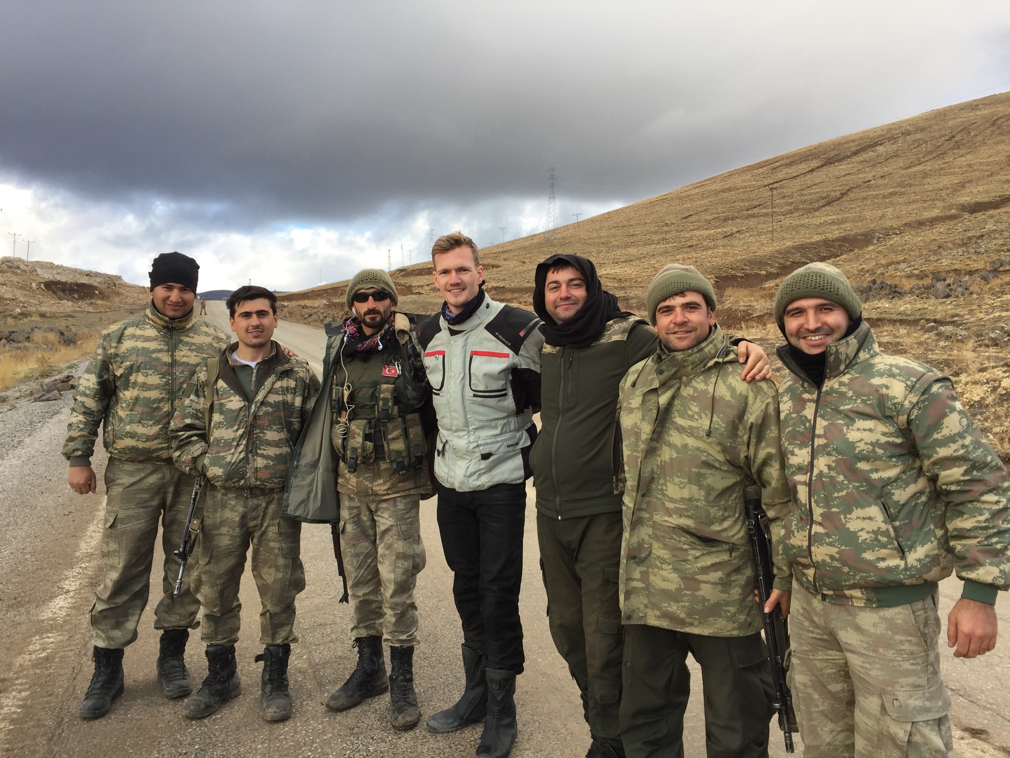 Men standing in front of mountain
